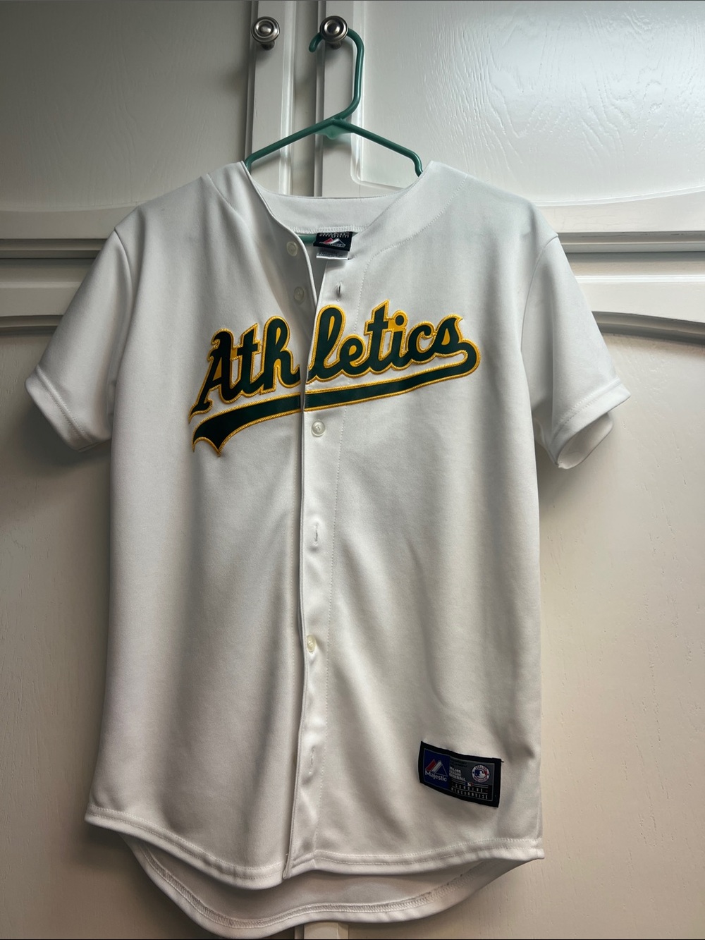 Majestic Athletics White Button-Front Team Jersey. I am 5’3” 115lbs and it fits.